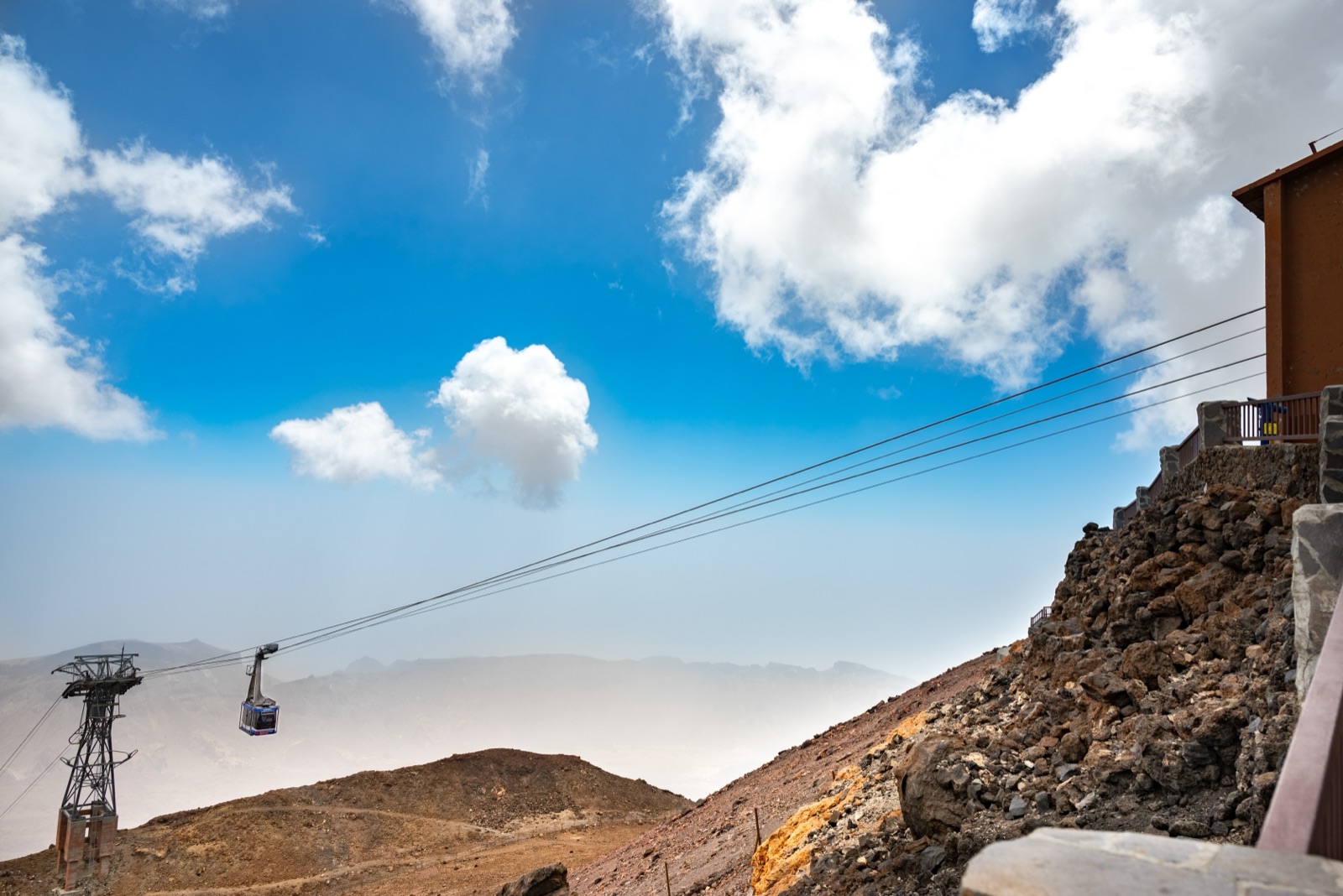 Teide cable car cabin riding the line above the volcanic slope near the upper station