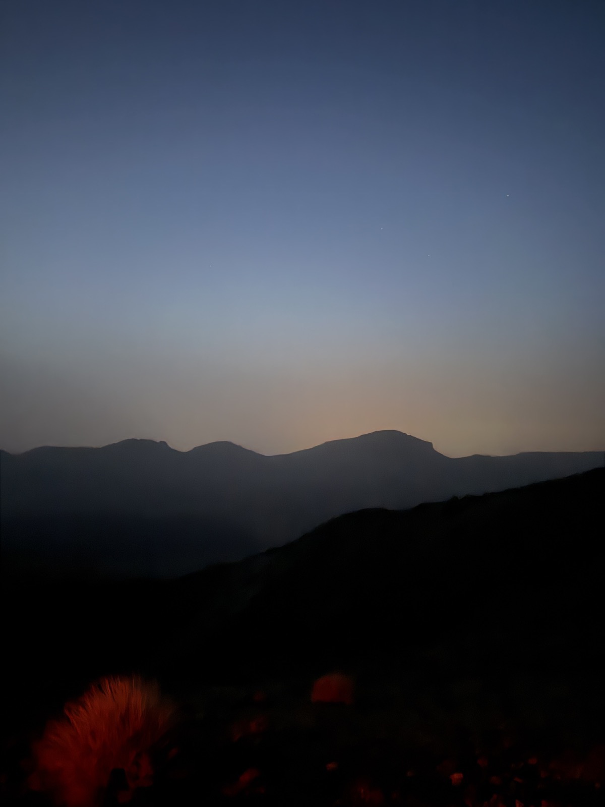 Pre-dawn light over dark ridge silhouettes seen from high on Mount Teide